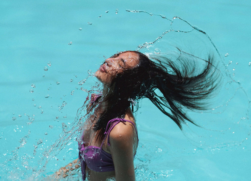 woman dark hair in pool 