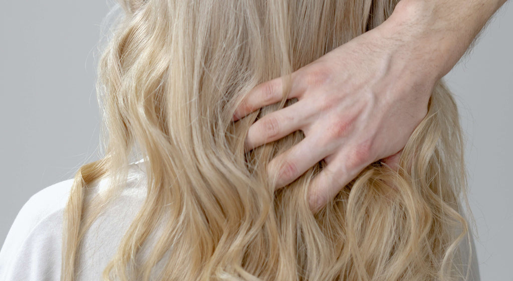 blonde curly hair hand