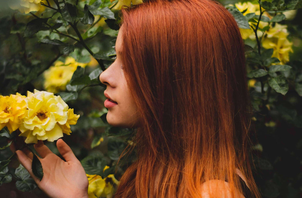 red hair woman flowers