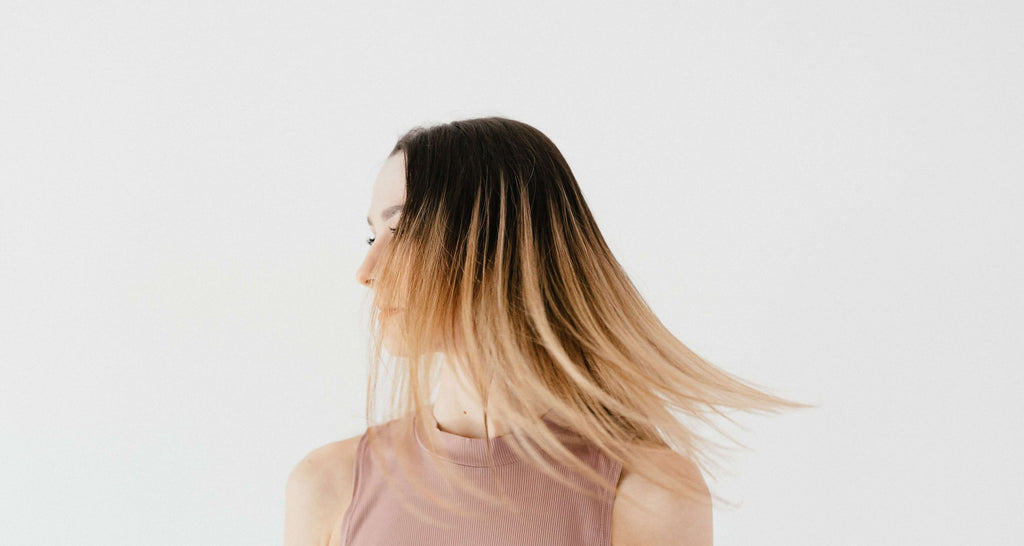 woman in pink shirt straight ombre hair