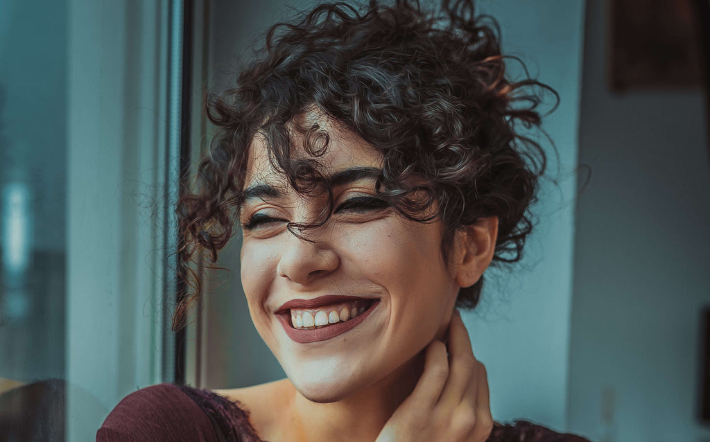 woman smiling curly hair